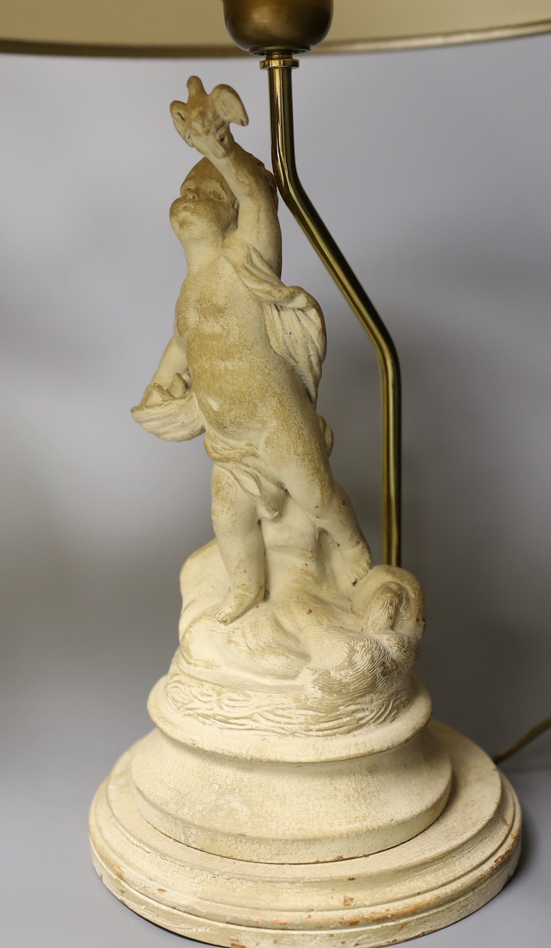 A pair painted composition cherub lamps on plinth base, altogether 43cm tall